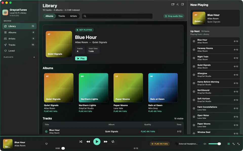 GraycatTunes showing a local music library with albums, track details, the current queue, and playback controls.